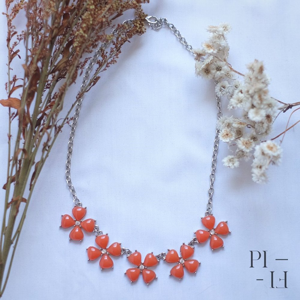 Beautiful summer necklace with orange flowers